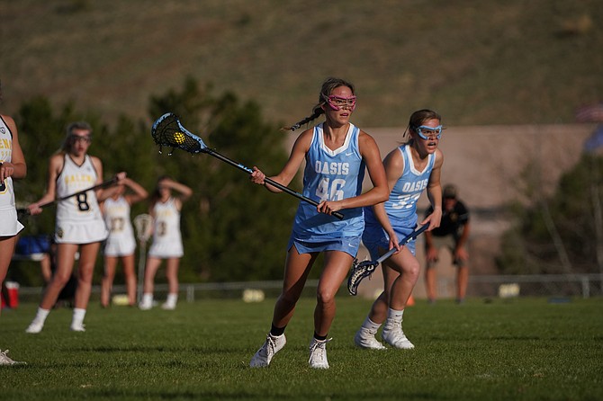 Oasis Academy’s Sadie O’Flaherty scores one of her nine goals in Thursday’s win over Galena in Reno.