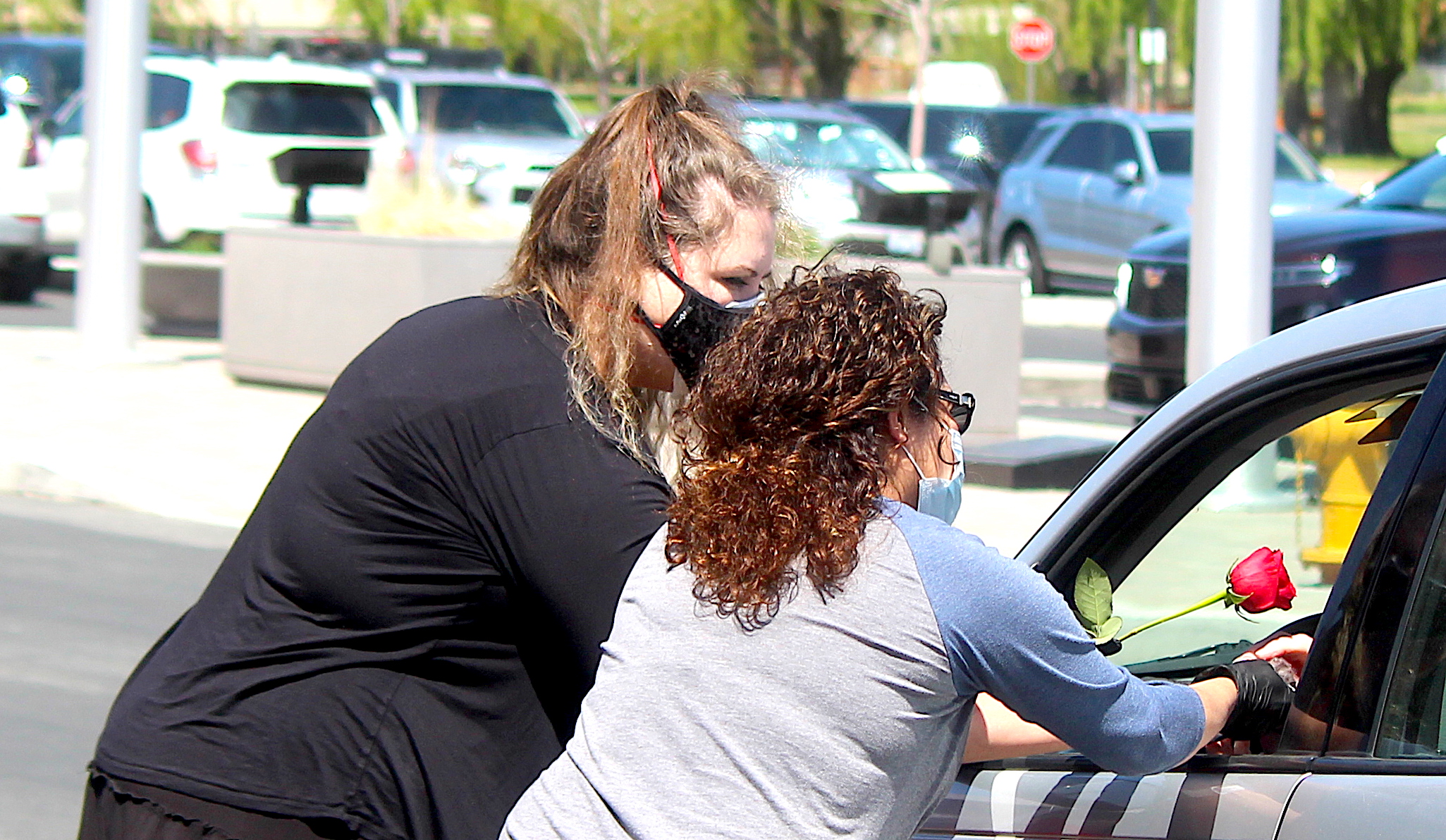 A rose for mom wraps up drive-through luncheons at Senior Center ...