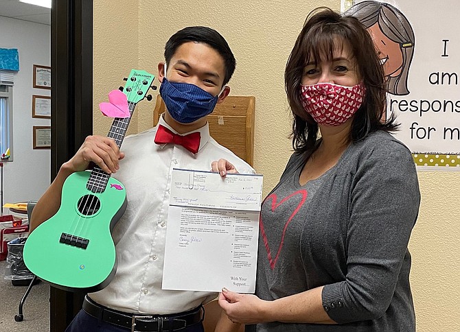 Fremont Elementary School music teacher Jonathan Chang celebrates mini grant funds for new instruments with Principal Jen Ward-DeJoseph.