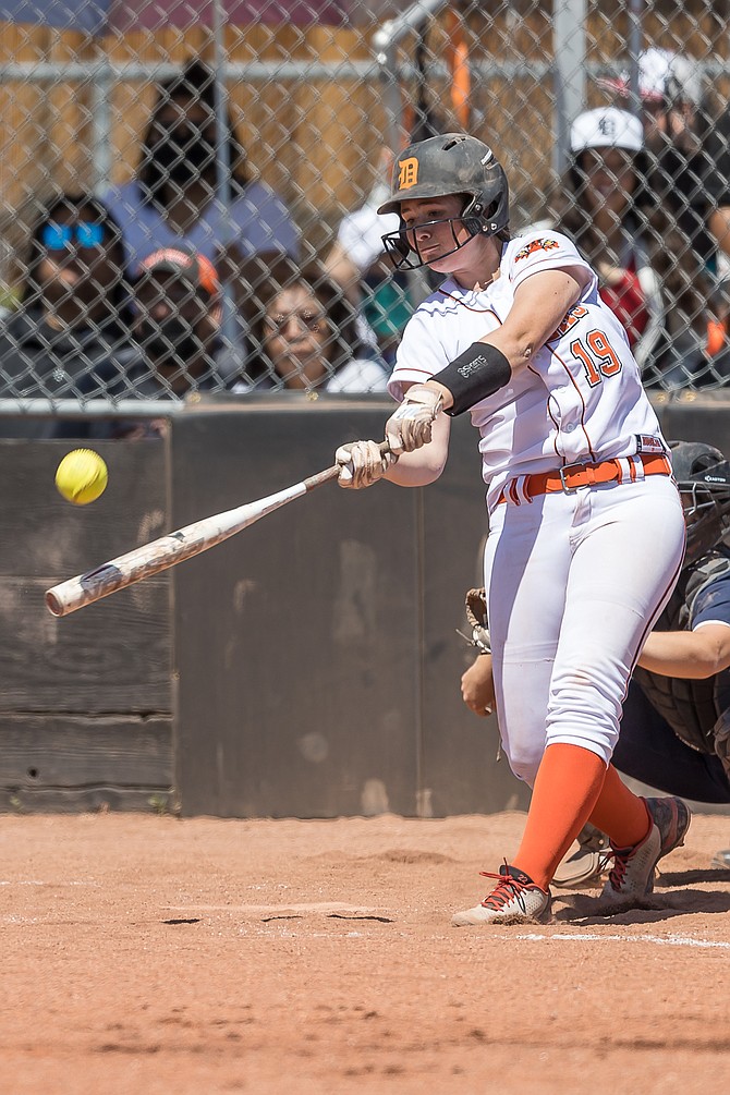 Douglas High freshman Talia Tretton turns on a ball during a contest against McQueen earlier this season. Tretton is hitting .400 in her first varsity season with the Tigers with two home runs, five doubles and 13 RBIs.