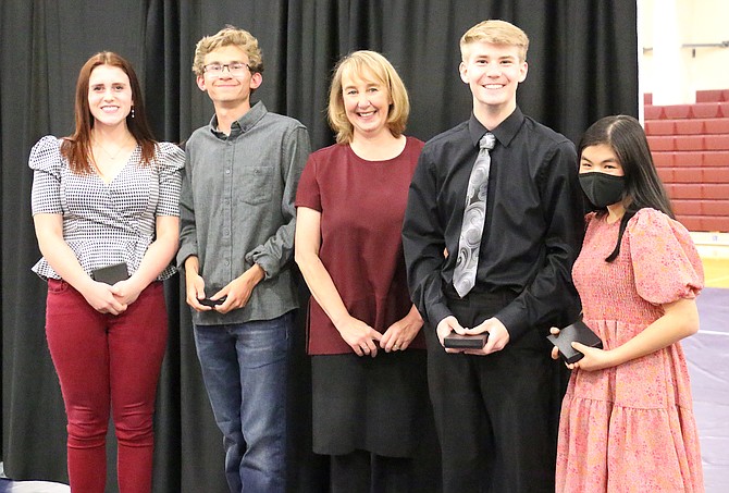 Sierra Lutheran High School’s four co-valedictorians, seniors Mikayla Talkington, left, Jake Tack, Principal Tami Seddon, Andreas Gilson and Elia Keating-McEllistrem, were named at the school’s 19th annual Honors and Awards Night on Tuesday. (Photo: Jessica Garcia/Nevada Appeal)