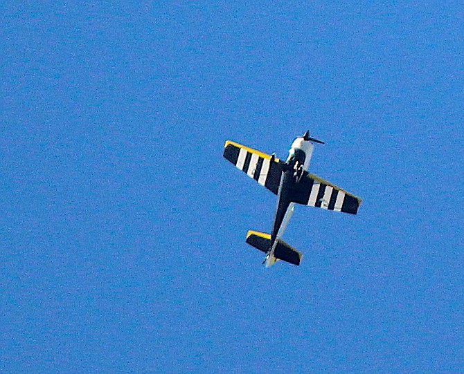 One of two sport planes conducting acrobatics over Genoa on Thursday evening.
