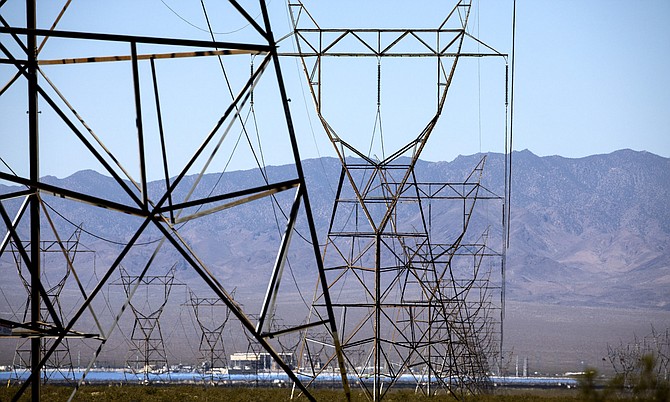 Power lines from Hoover Dam stretch through Eldorado Valley south of Boulder City on Friday, June 16, 2016.