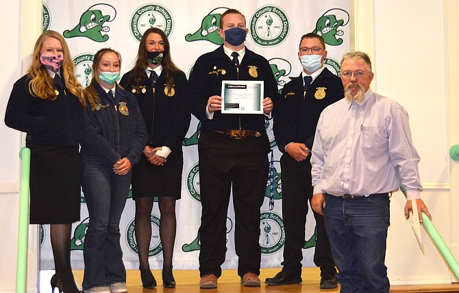 The Churchill County School Board recognized the Churchill County High School FFA Chapter students for placing first for the State of Nevada National Chapter Award. From left are Natasha Emke, Haley Hancock, Savana Manha, McKay Winder, Gavin McLean and Trustee Fred Buckmaster.
