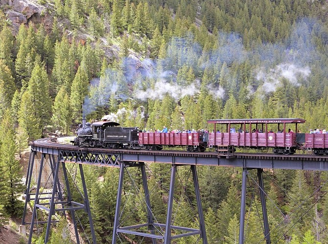 An exciting ride on the Georgetown Loop Railroad is one of the four trains featured in the Train & Parks of Colorado Tour in July 2022.
