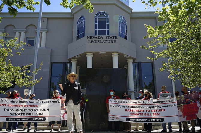 Phil Jaynes, president of the International Alliance of Theatrical Stage Employees Local 720, addresses demonstrators in front of the statehouse on Tuesday in Carson City. (Photo: Samuel Metz/AP)