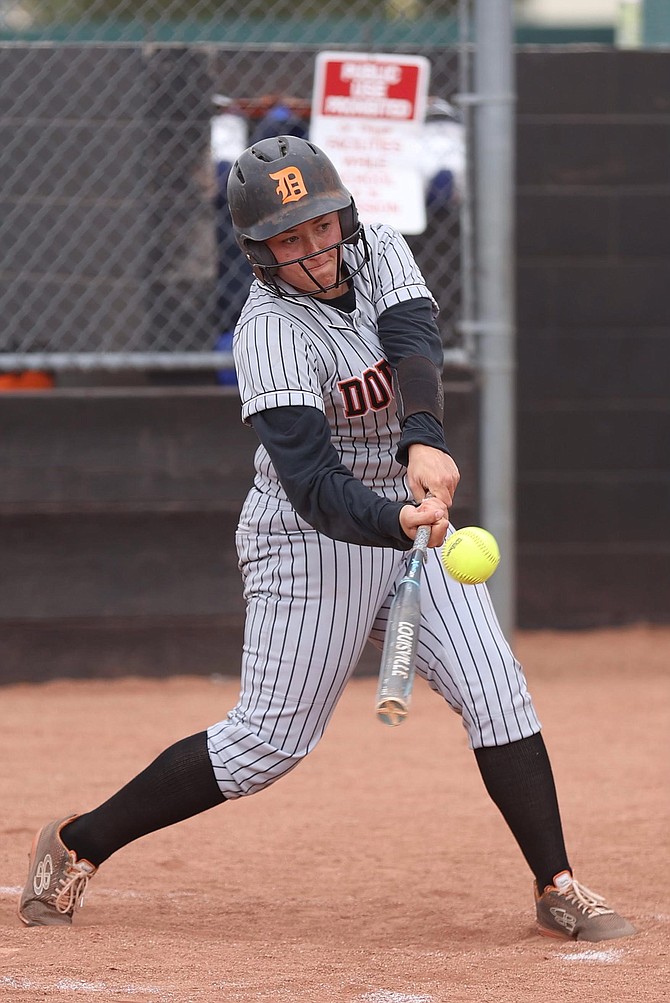 Ashley Delaney ropes her third-inning home run against Reno High in the Northern Nevada Class 5A regional softball tournament. Delaney drove in three RBIs in the win.