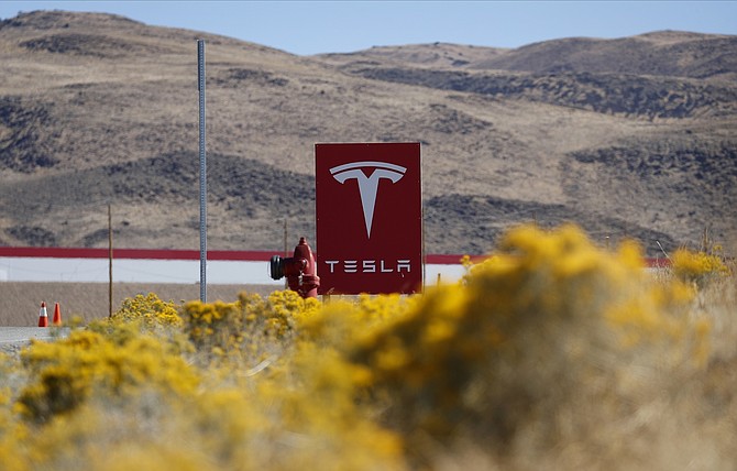 A sign marks the entrance to the Tesla Gigafactory in Storey County, seen Oct. 13, 2018. (Photo: John Locher/AP, file)