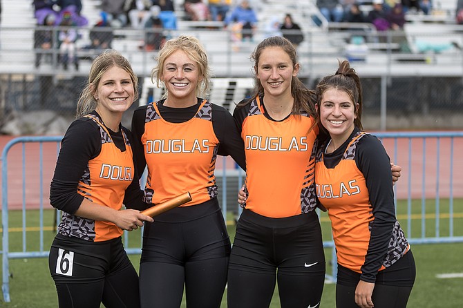 Douglas High’s 4x200 relay team smiles after winning a regional title. Pictured from left to right are Jessica James, Ellie Gansberg, Megan Veil and Julianne James.