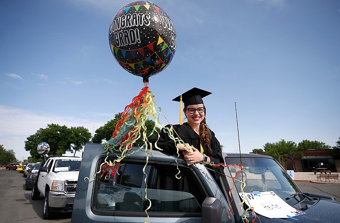 Graduate Heidi Tapia waits for the start of Western Nevada College’s 2020 Parade of Graduates at the Fallon campus.