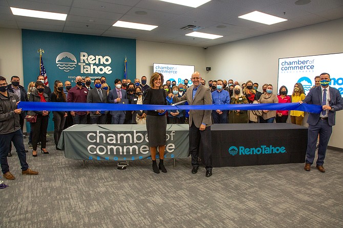 The Chamber's Ann Silver and RSCVA's Charles Harris cut the ribbon on May 21 at the new shared office space.