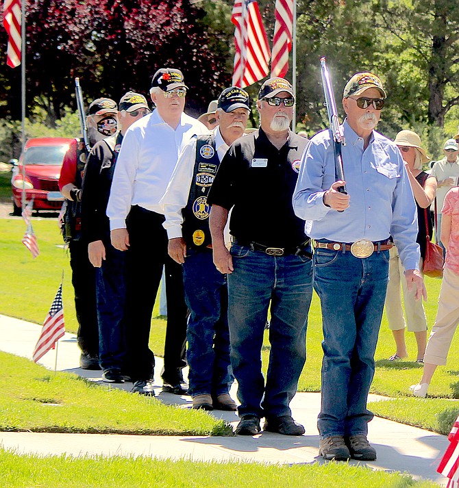 An honor guard of Vietnam veterans marches at Eastside Memorial Park on Monday in observance of Memorial Day.