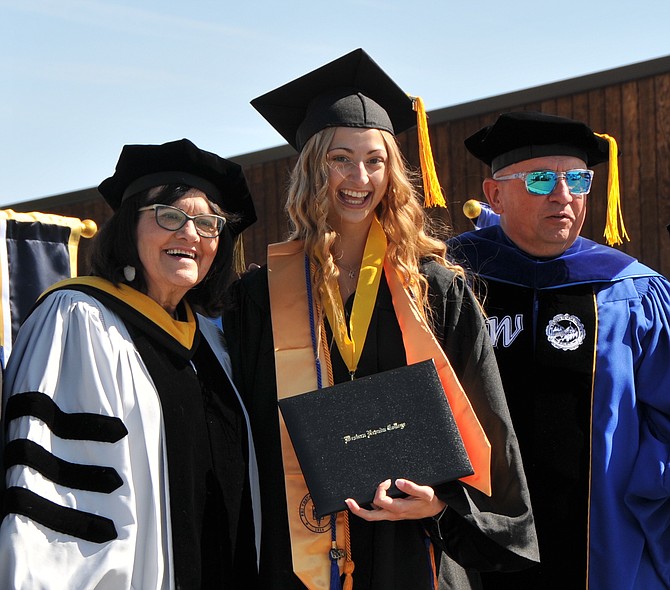 WNC graduate Melanie Plasse, center, is flanked by Regent Cathy McAdoo left, and WNC President Vincent Solis.