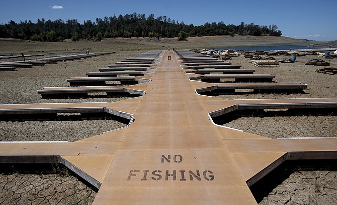 Empty boat docks sit on dry land at the Browns Ravine Cove area of drought-stricken Folsom Lake, currently at 37% of its normal capacity, in Folsom, Calif., on May 22, 2021. (Photo: Josh Edelson/AP)