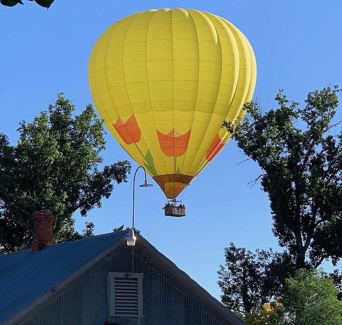 If it's Sunday morning in Gardnerville, there's probably a balloon hovering overhead. Jack Jacobs sent in this photo of a hot air balloon drifting over the Berry Farm.