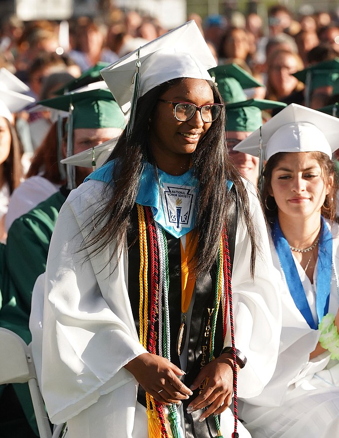 Honors School Co-valedictorian Vera Vaz walks up to the stage before giving her speech.