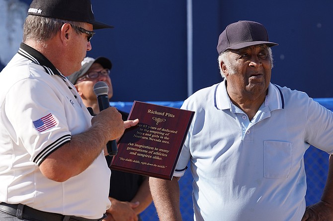 Fallon's Brian Itskin, left, presented Richard Pitts with a Lifetime Achievement Award during the 2019 youth softball state tournament in Reno.