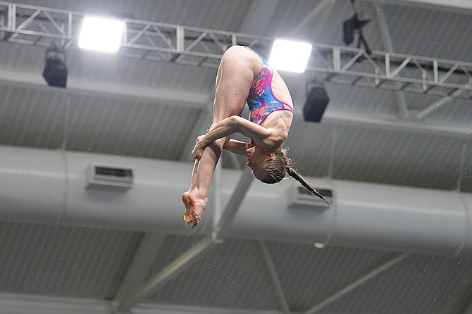 Krysta Palmer rotates through the air during a 3-meter synchronized dive with partner Alison Gibson. The pairing was secured the first spot on the U.S. Diving Olympic Team Thursday night.