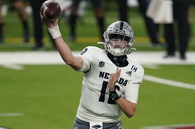 Nevada quarterback Carson Strong throws against UNLV on Oct. 31 in Las Vegas. (Photo: John Locher/AP, file)