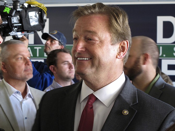 Then-Nevada Republican Sen. Dean Heller talks to supporters before a joint appearance with Ivanka Trump at the GOP field office in Reno on Nov. 1, 2018. (AP Photo/Scott Sonner)