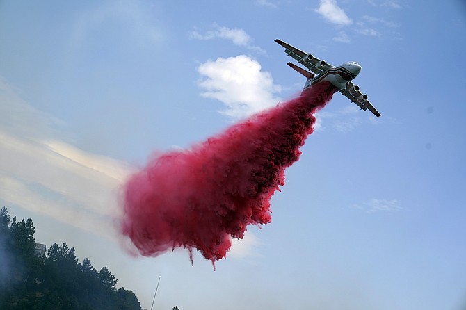 An air tanker drops retardant on the Bobcat fire Sept. 18, 2020, in Mount Wilson, Calif. (AP Photo/Marcio Jose Sanchez)