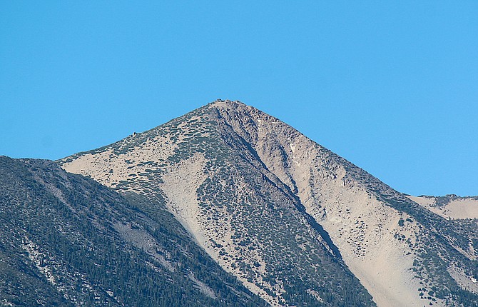 The last tiny patches of snow cling to the north face of Jobs Peak on Wednesday afternoon.