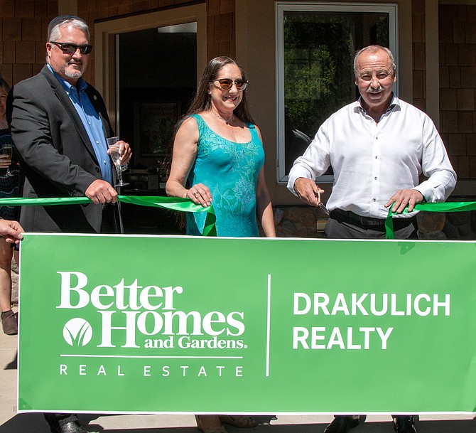 From left, Sparks Mayor Ed Lawson and Kimberly and Bryan Drakulich were on and for a special ribbon cutting event to welcome the Better Homes and Gardens Real Estate LLC brand.