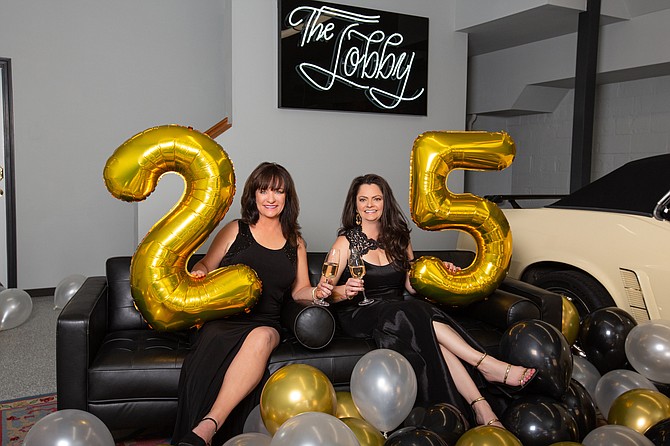 Kim Ciesynski, left, and Camille Bailey celebrate the company's 25th anniversary.