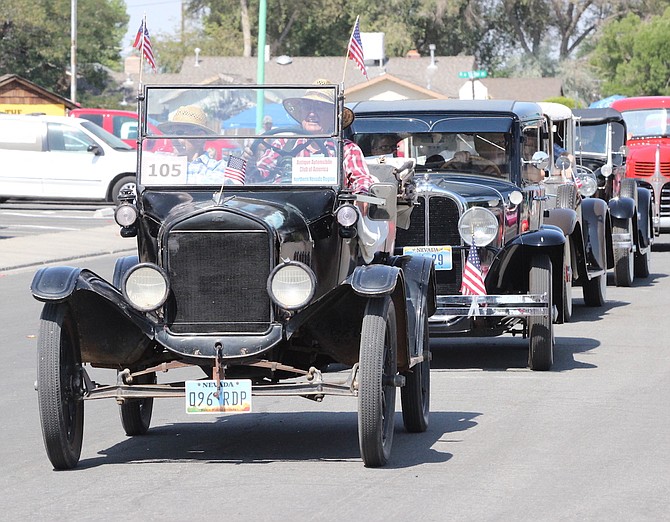 Vintage automobiles will motor down the city streets Saturday to kick off the Fourth of July weekend with a parade.