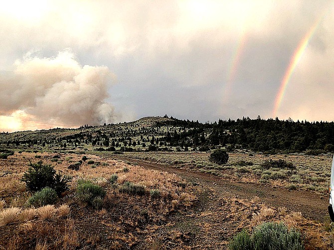 Moisture helped slow down the East Fork Fire burning in Alpine County and produced a double rainbow. U.S. Forest Service photo