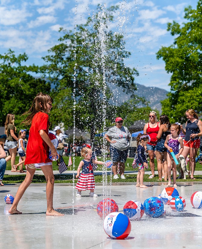The Minden Splash Pad is going to be pretty popular this week as temperatures climb into triple digits. Here children play during Minden's Fourth of July celebration.