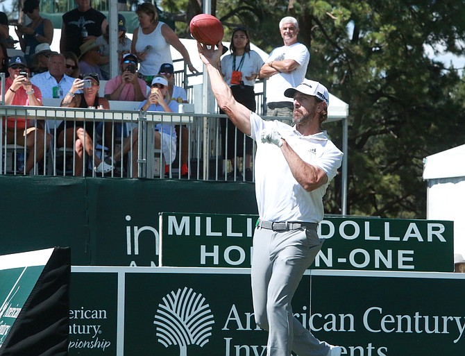 Aaron Rodgers throws a pass into Lake Tahoe Friday afternoon on the tee box of the 17th hole at Edgewood Tahoe Golf Course during the American Century Championships Pro-Am tournament.
