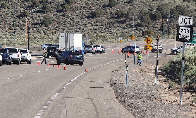 Nevada Highway Patrol troopers detour traffic down Highway 208 after a 6.0 magnitude earthquake near Walker closed Highway 395 on Thursday.