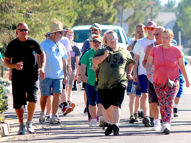 Special Olympians and Douglas County Sheriff's Office personnel conduct a torch run on Friday morning in Gardnerville.