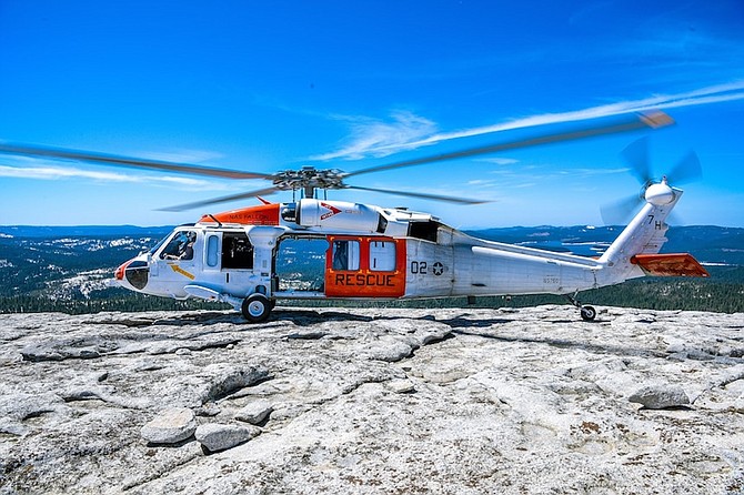 In this Navy file photo, a MH-60S Knighthawk helicopter assigned to the “Longhorns” of Helicopter Search and Rescue (SAR) Squadron, lands during a Last Final Flight (LFF).