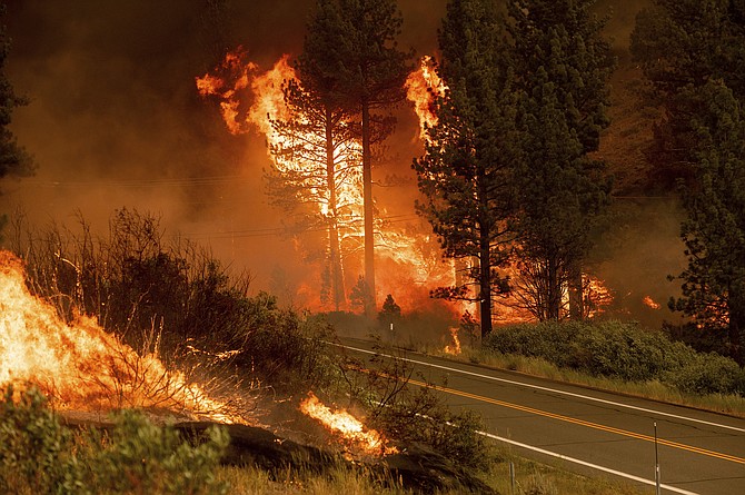 The Tamarack Fire burns in the Markleeville community of Alpine County, Calif., on Saturday, July 17, 2021. (AP Photo/Noah Berger)