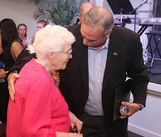 Steve Ranson / LVN
Fallon Mayor Ken Tedford hugs Faye Tewell, widow of former Fallon City Councilman John Tewell, after his Celebration of Life.