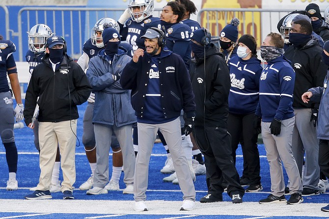 Nevada head coach Jay Norvell, center, looks on from the sidelines in the final minutes against Tulane during the Potato Bowl on Dec. 22 in Boise, Idaho. Nevada won 38-27. (Photo: Steve Conner/AP, file)