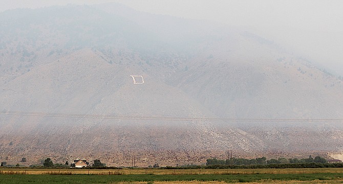 Carson Valley's famous inversion layer kept smoke off the deck for a short while on Sunday.