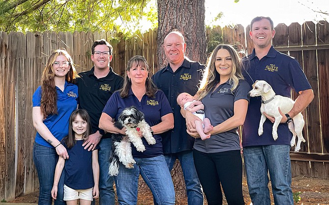 The Mountain family of Slieve Brewing Company is preparing to open a family-owned nano brewery in Reno. From left: Caitlin, Mckinley, Matt, Shannon, Philip, baby Brooks, Saundra, and Mitch. Family dogs are Rocky, left, and Kane.