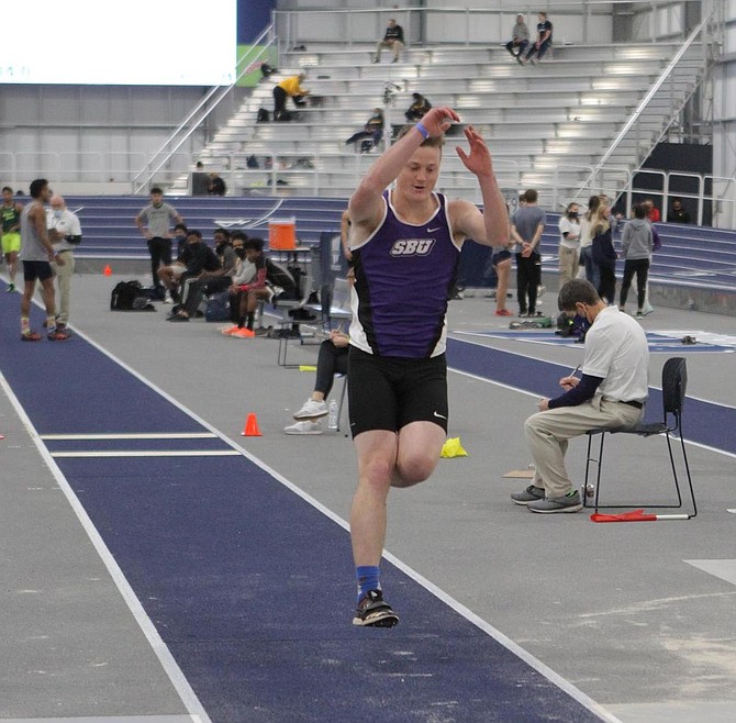 Asa Carter jumps during a meet while wearing the Southwest Baptist uniform. Carter was a two-time All-American in the long jump while with the Bearcats.