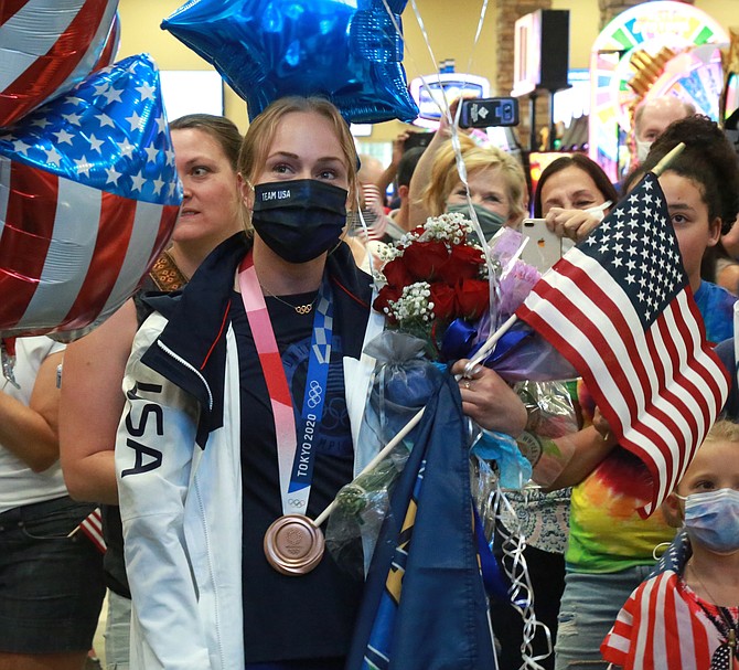 Krysta Palmer looks on at the celebration at Reno-Tahoe Airport upon her return to Northern Nevada.