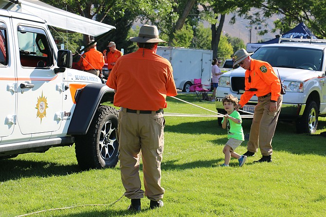 Search and Rescue brought a Jeep and had children help them tow it using a pulley system at Mills Park during the Sheriff's Night Out on Tuesday.