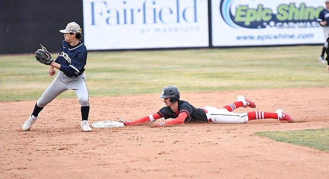 Douglas High graduate and Northwest Nazarene Nighthawk Haden Keller slides into second base during a game this season. Keller and the Nighthawks won their conference title this spring before qualifying for the Div. II College World Series in Cary, North Carolina.