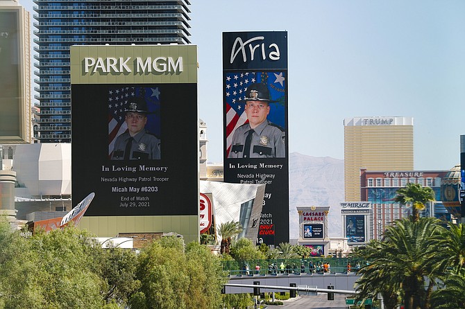Casino marquees display an image honoring fallen Nevada Highway Patrol Trooper Micah May on Friday in Las Vegas. (Photo: Wade Vandervort/Las Vegas Sun via AP)