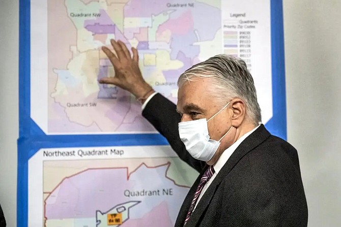 Gov. Steve Sisolak points to a map where the COVID-19 surge teams are concentrating on in Clark County during a news conference in Las Vegas on Thursday, July. 22, 2021.