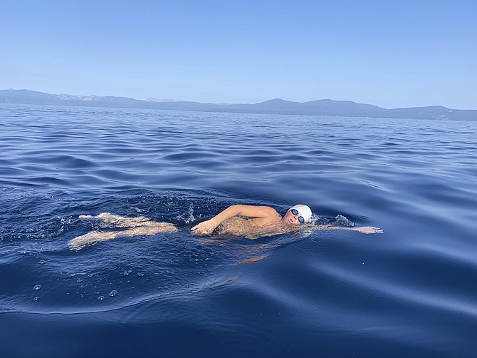James Savage, 14, of Los Banos, Calif., swam the 21.3-mile length of Lake Tahoe from South Lake Tahoe, California to Incline Village, Nevada on Aug. 1. (AP Photo/By Jillian Savage)