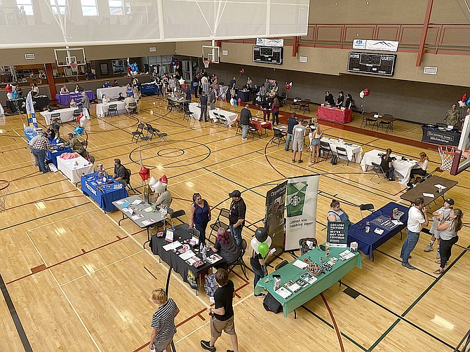 Job seekers visit employers during a youth and teen job fair at the Douglas County Community Center.