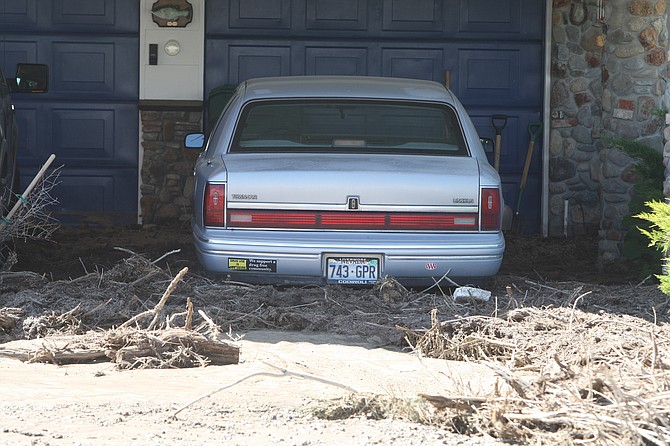 Mud and debris flooded a Johnson Lane garage in July 2014. Work to reduce the effects of flash flooding in the Carson Valley neighborhood is under review.