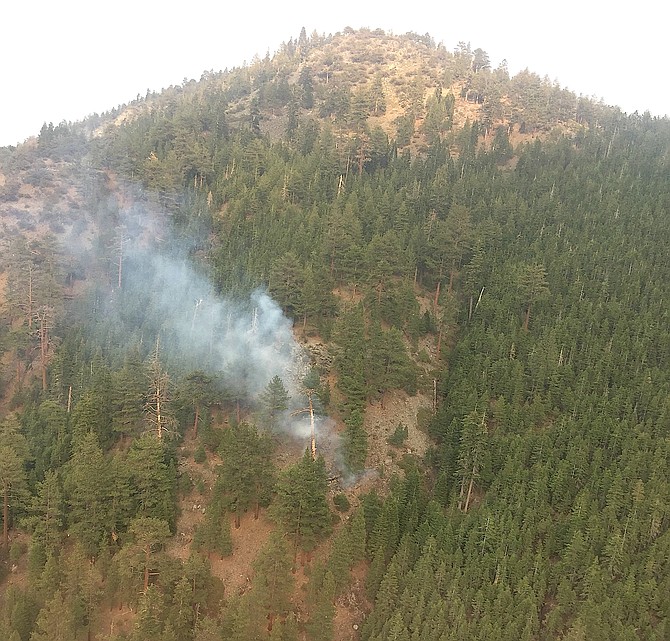 Smoke rises from a fire started by a lightning strike near Jobs Peak in this Humboldt-Toiyabe Forest photo.
